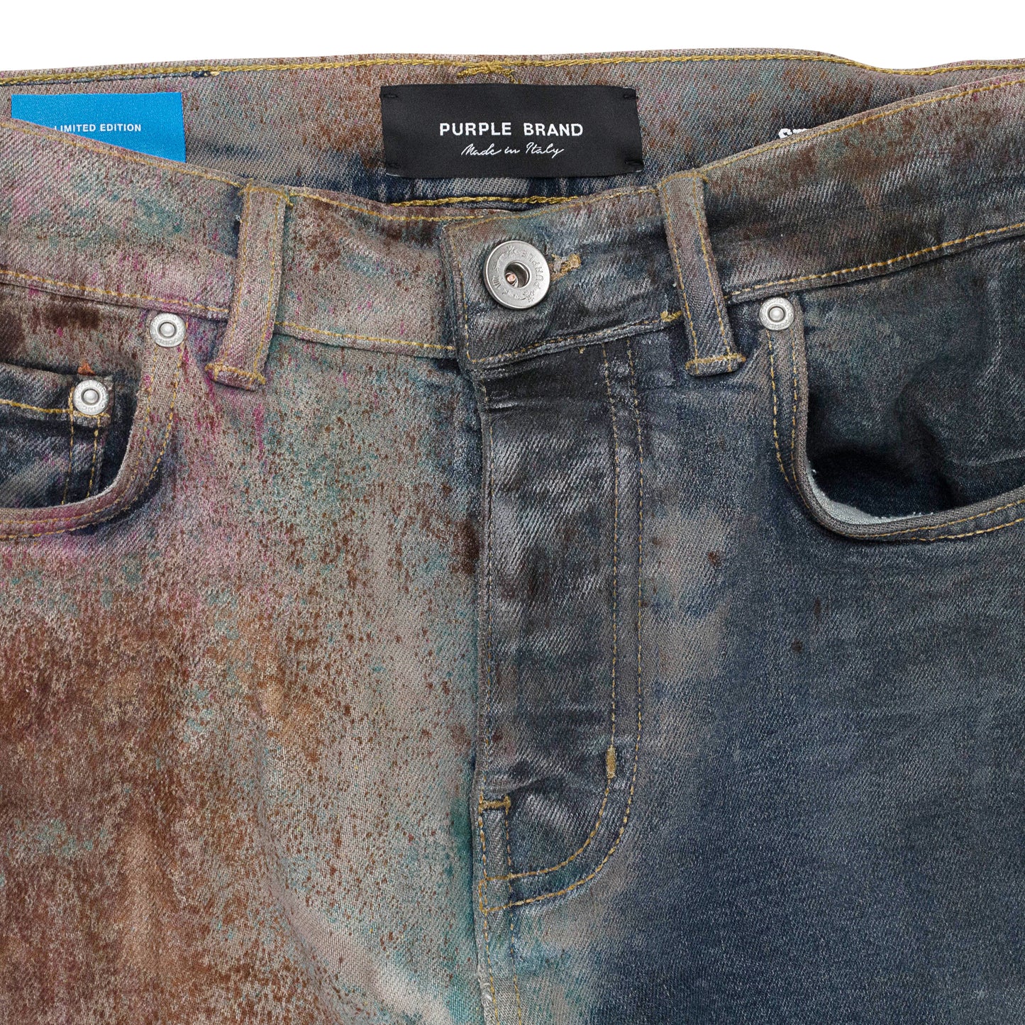 MULTICOLOR SPRAY OVER BLEACHED Indigo SKINNY JEANS