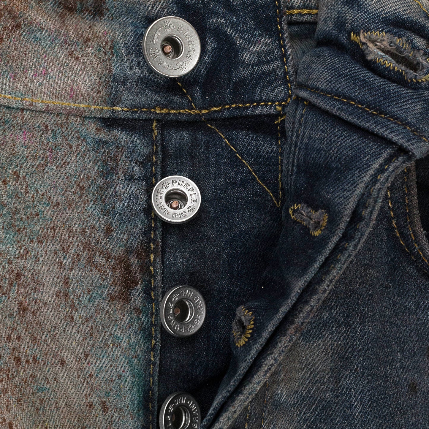 MULTICOLOR SPRAY OVER BLEACHED Indigo SKINNY JEANS