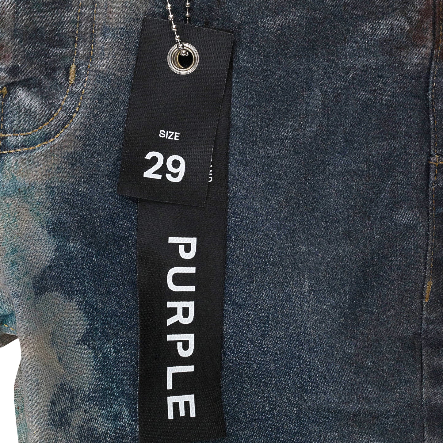 MULTICOLOR SPRAY OVER BLEACHED Indigo SKINNY JEANS