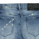 BLUE CLAYTON DISTRESSED PAINT SKINNY JEANS